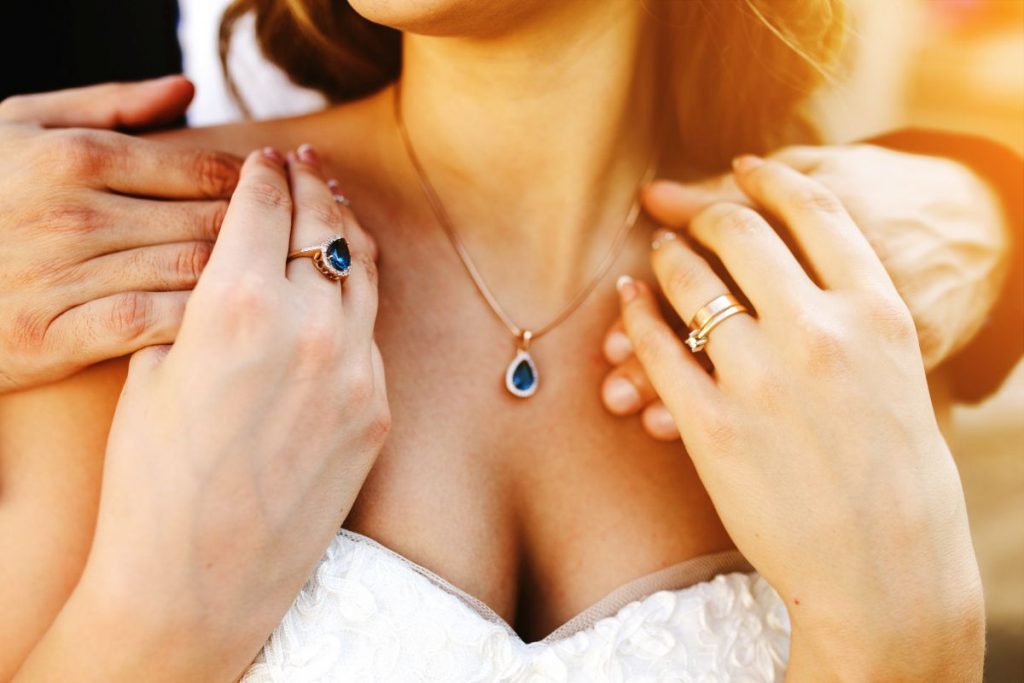 The Groom Holds His Bride From Behind With Both Hands