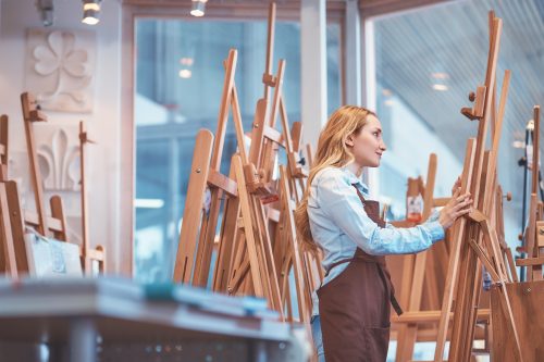 Attractive Artist Painting At The Easel